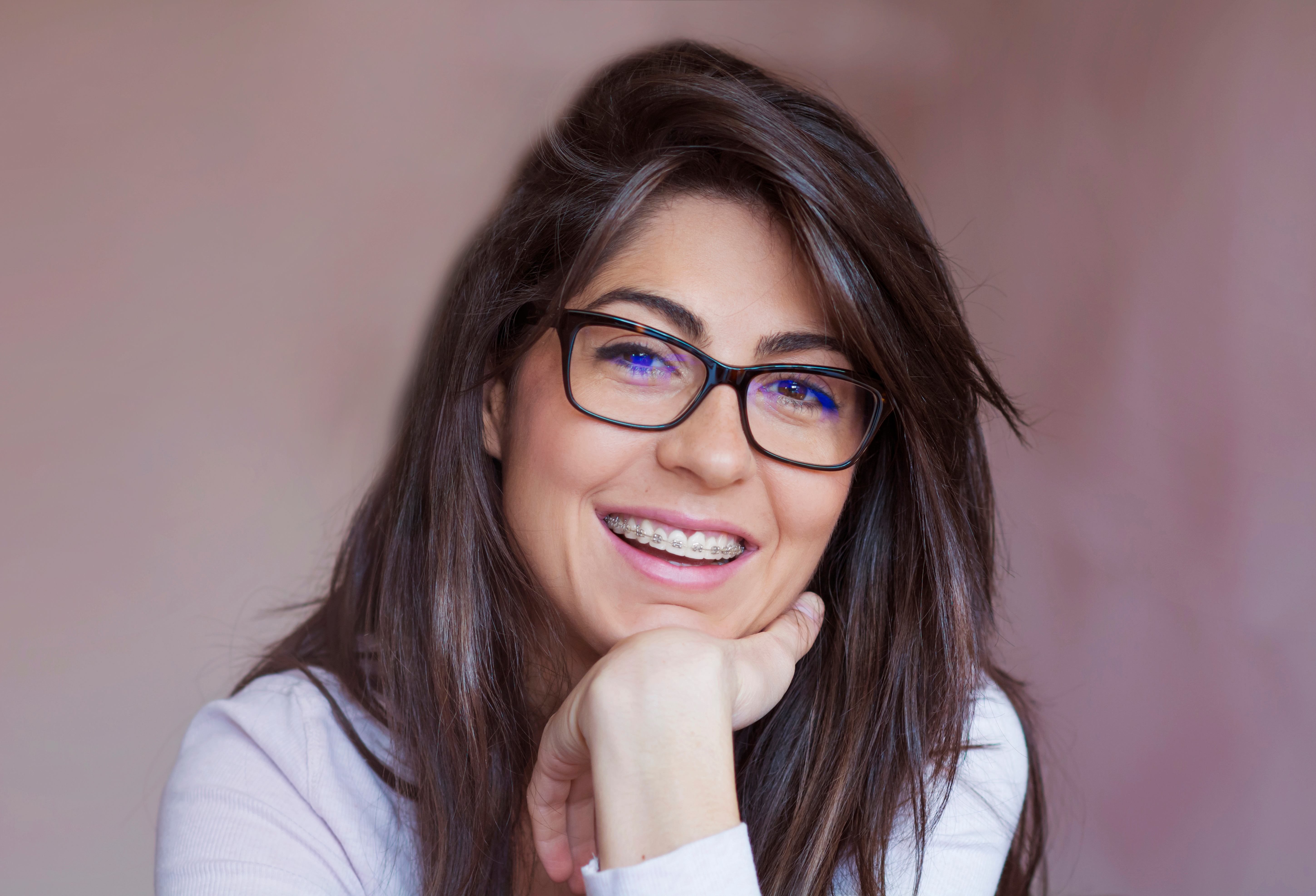 Smiling adult woman with braces